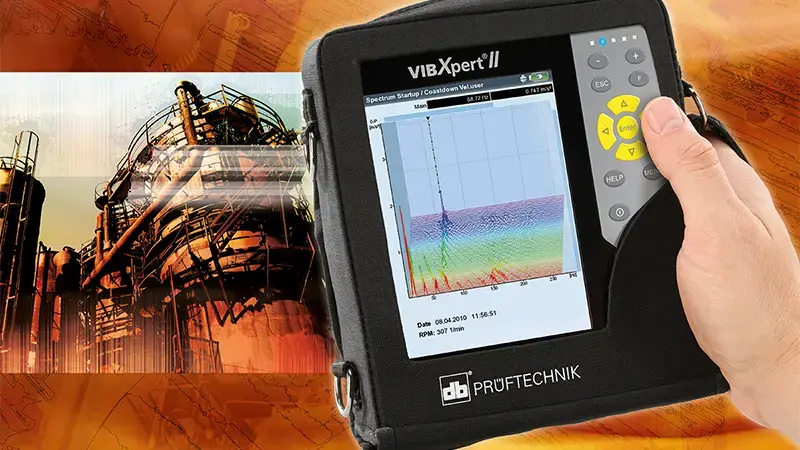 Single hand holding the VIBXPERT II